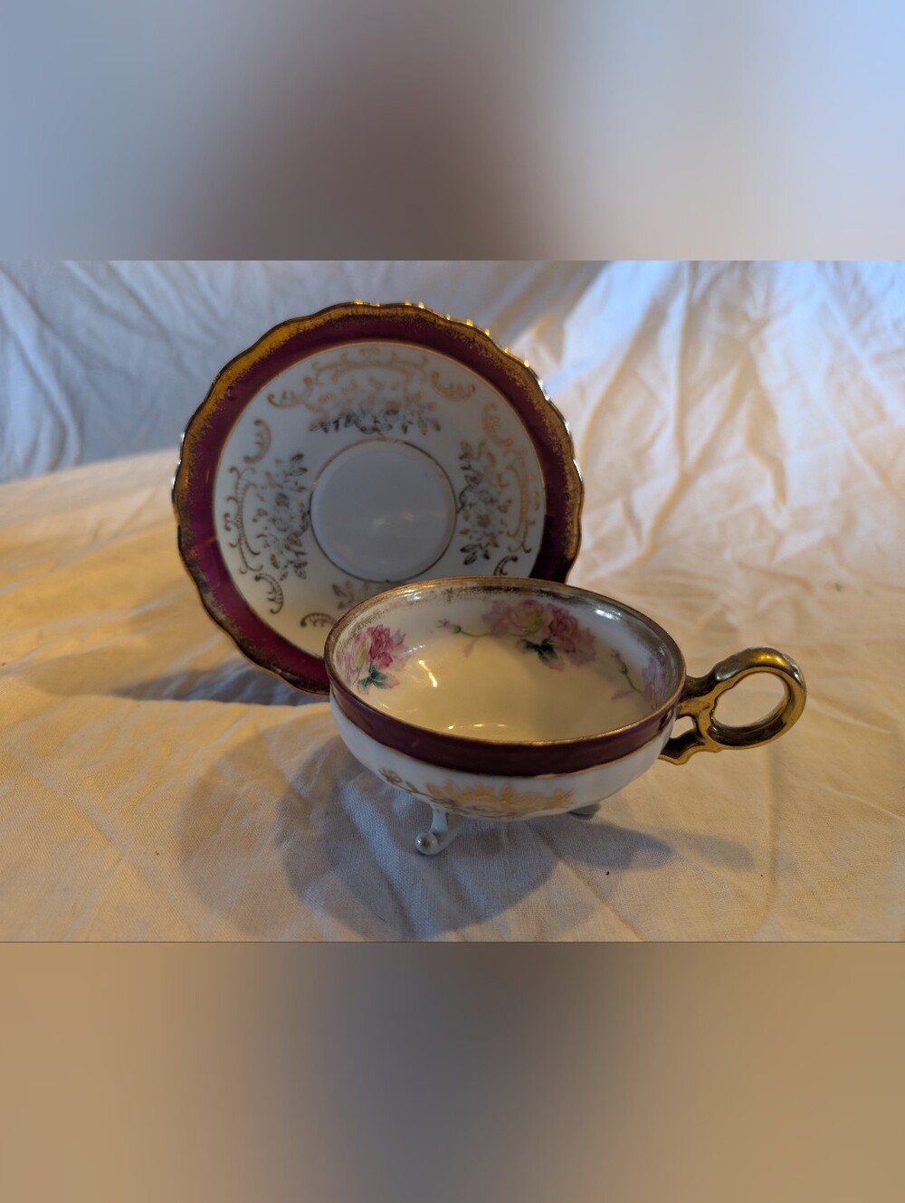 2/40$ Plum and Gold Porcelain Footed Teacup and Saucer - Floral Accent